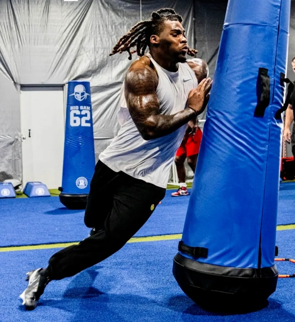 Texas Athletics USA football athlete training on the sled in Northwest Houston
